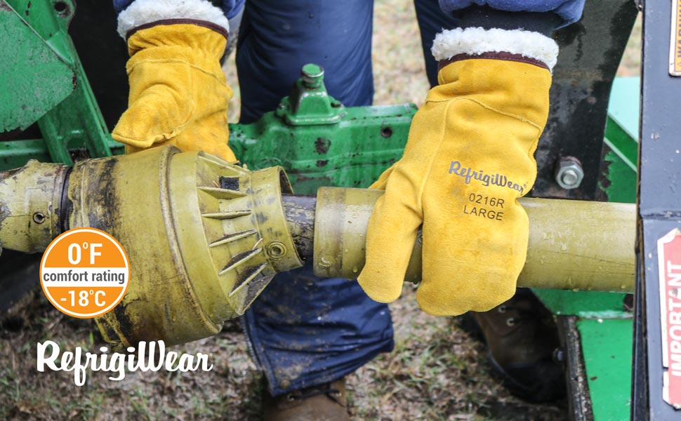 man using the 3 finger mitt working in the cold on a pipe