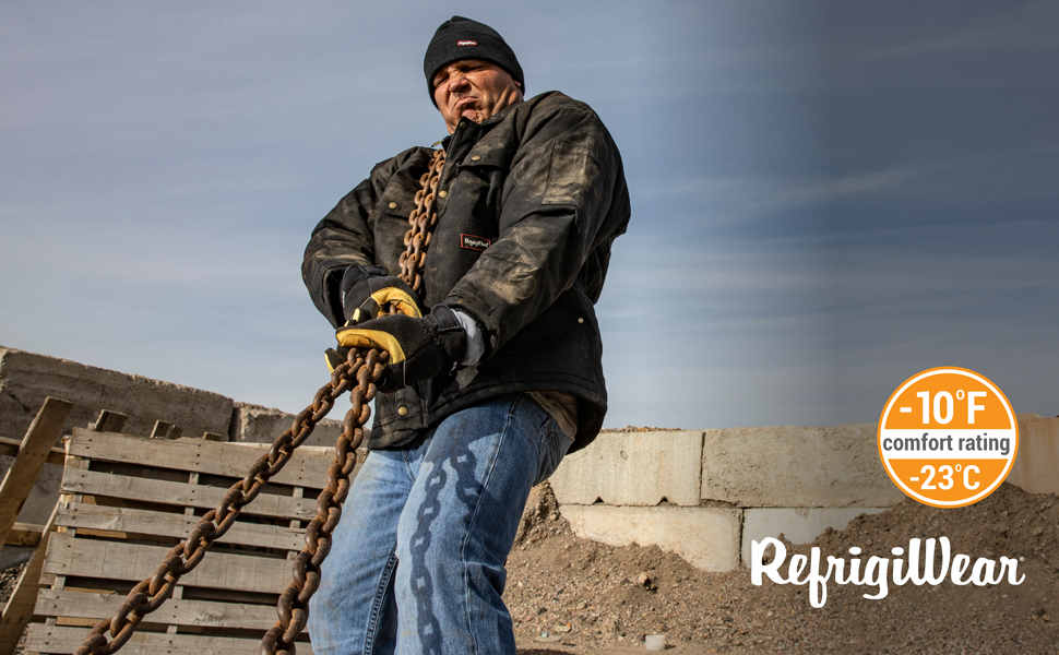 Man wearing the ComfortGuard Utility Jacket outside in the cold pulling a chain.
