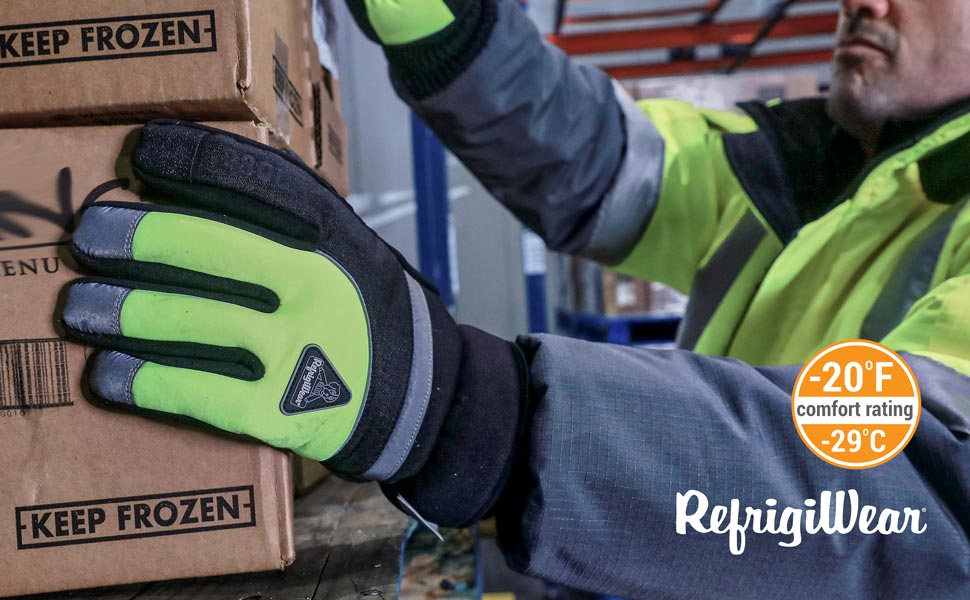 Man wearing the Freezer Edge Gloves in a freezer handling a box.