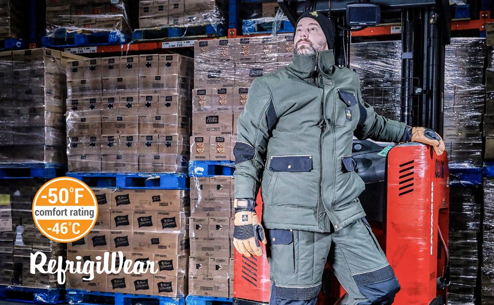 Man wearing the 54 Gold jacket standing in a cold storage warehouse on a forklift.